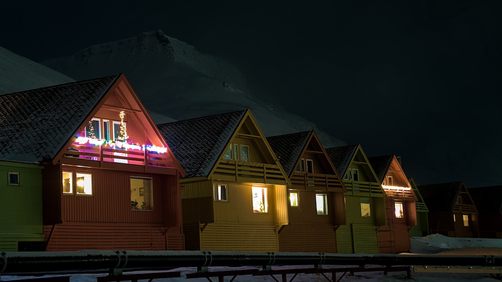 The colourful Spitshusene in Longyearbyen with Christmas lights