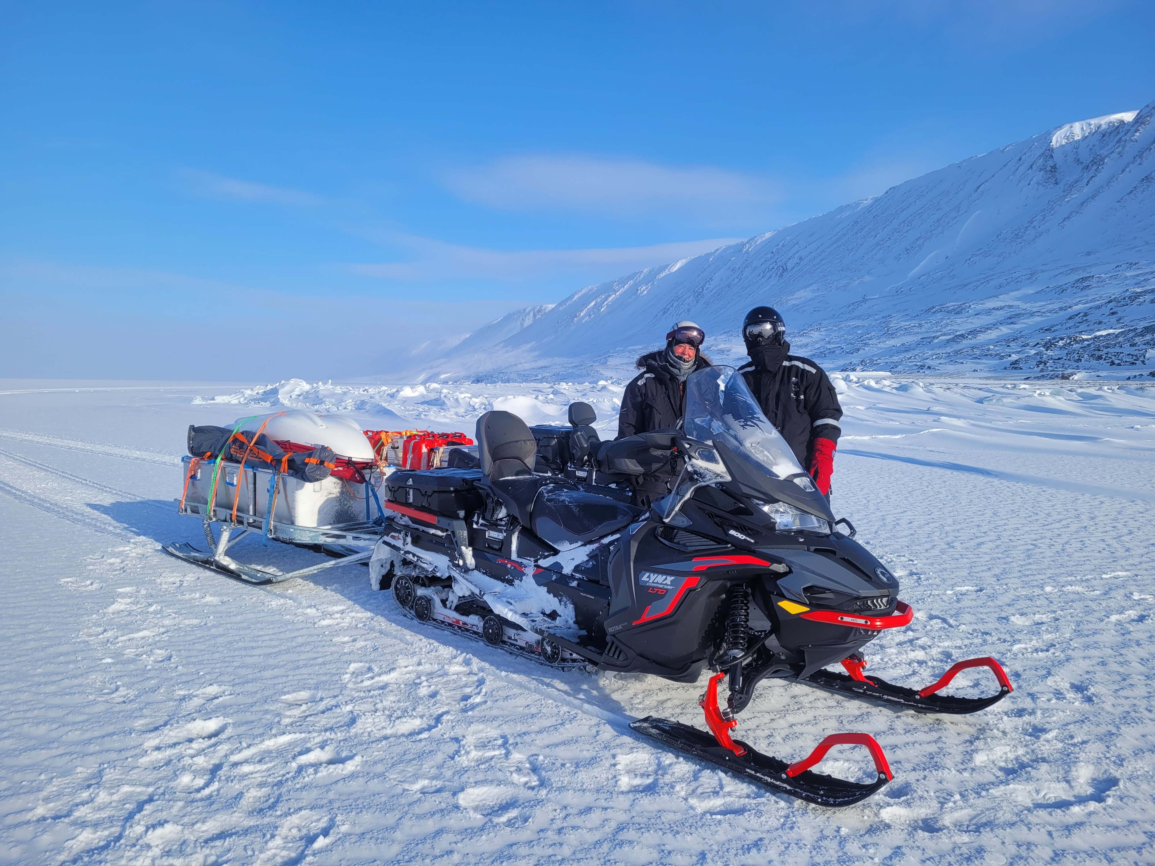 Snowmobile transport for ski tour on Svalbard