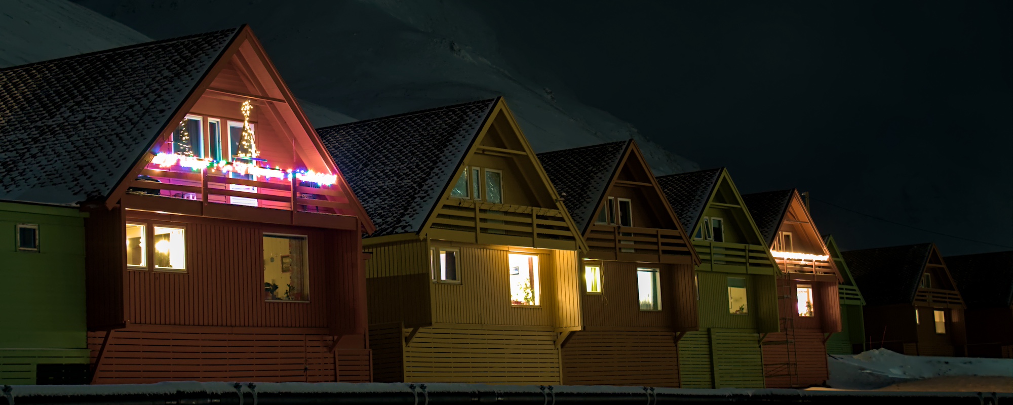 The colourful Spitshusene in Longyearbyen with Christmas lights