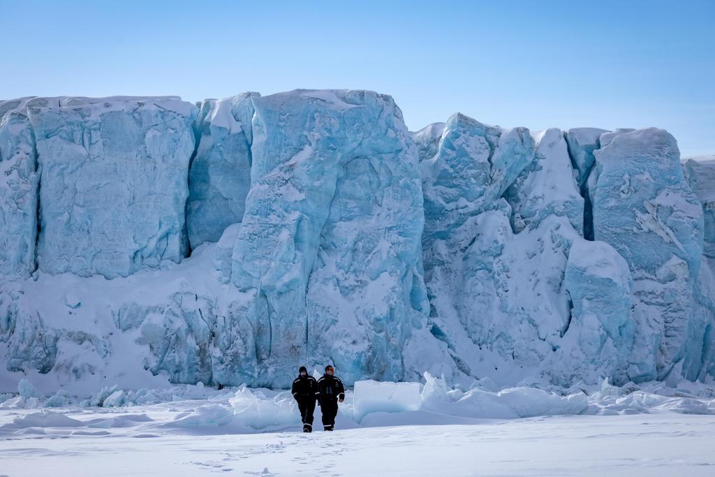 Walk in front of glacier front